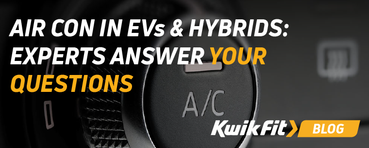 A person holding their hand up to the air conditioning vent in their EV.