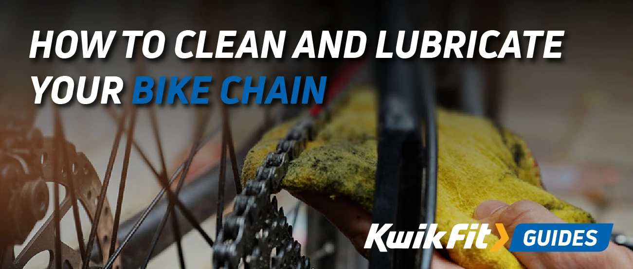 Someone cleaning a dirty bike chain