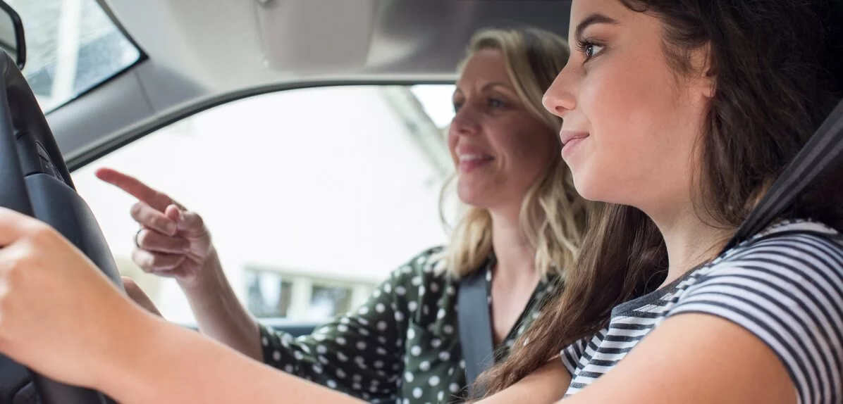 Two women driving car