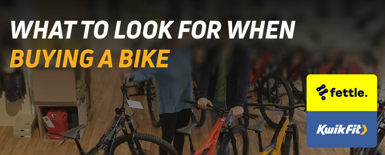 People looking at bikes in a shop